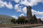 LOOKING AT SHAWNEE ATSF STATION FROM CROSSING